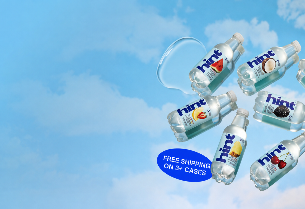 View of Hint flavored water bottles floating against a blue sky with FREE SHIPPING ON 3+ CASES