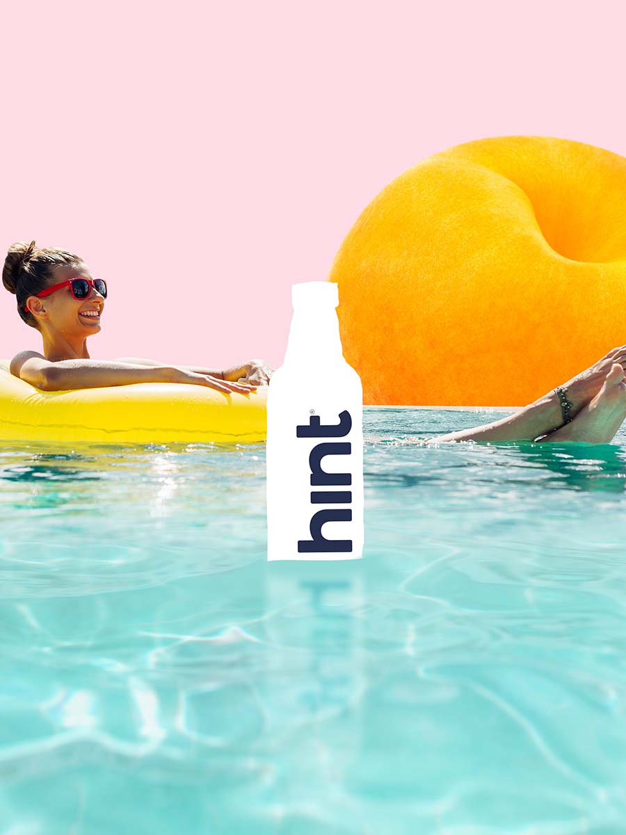 A graphic collage of a woman sitting in a yellow floaty in a bright pool on a sunny day. There are graphics of fruit, hint bottle and a coconut in the pool too.