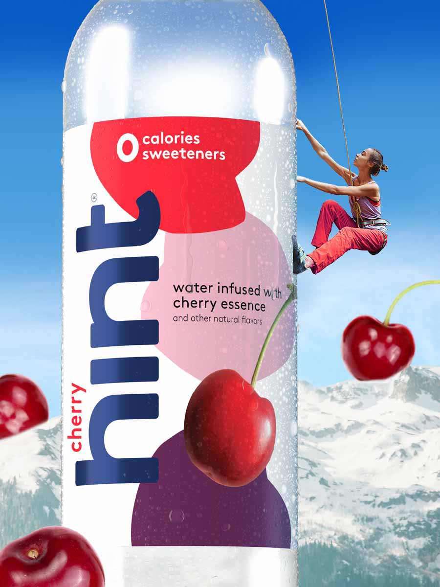 A collage of a woman climbing up, like a mountain climber up, a 1L bottle of cherry hint water. 