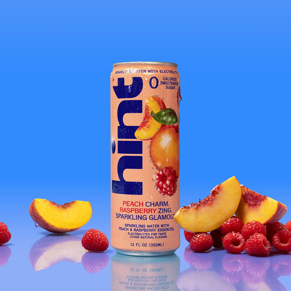 Can of Hint sparkling water with peach and raspberry artwork, labeled zero calories, sweeteners, and sugar, 12 fl oz